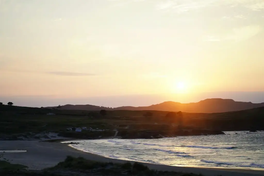 the sun setting over the lands of Ferrol in Spain