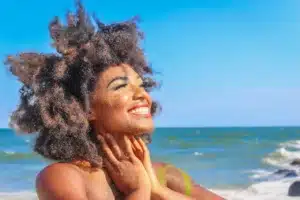 Lady On A Beach Smiling